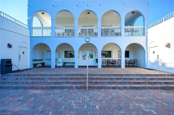 a view of a chairs and table on the terrace