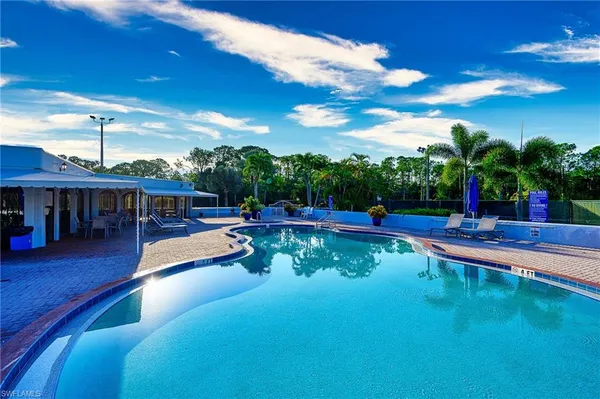 a view of a swimming pool with a patio