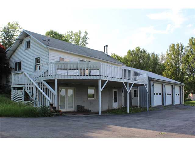 Exterior Front. Spacious vinyl sided home. 3 bay e