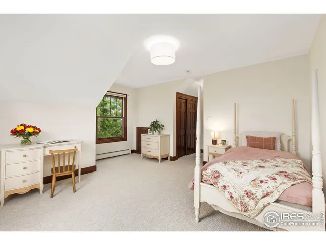 a bedroom with a bed and a cabinets