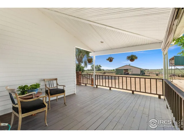 a view of a terrace with furniture and wooden floor