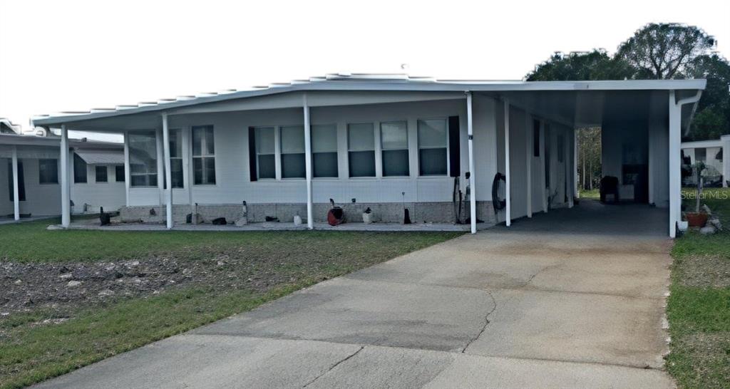 a view of house with backyard