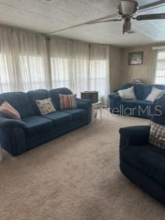 1211 Apache Circle Tavares, FL 32778 - Photo 3 of 9 a living room with furniture and a large window