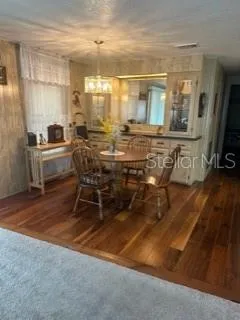 a room with wooden floor and furniture