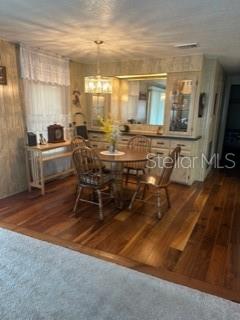 1211 Apache Circle Tavares, FL 32778 - Photo 4 of 9 a room with wooden floor and furniture