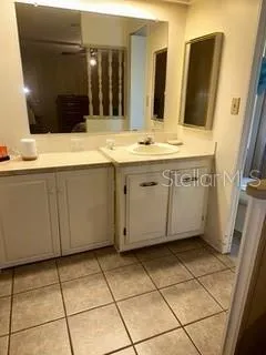 a bedroom with a bed and dresser