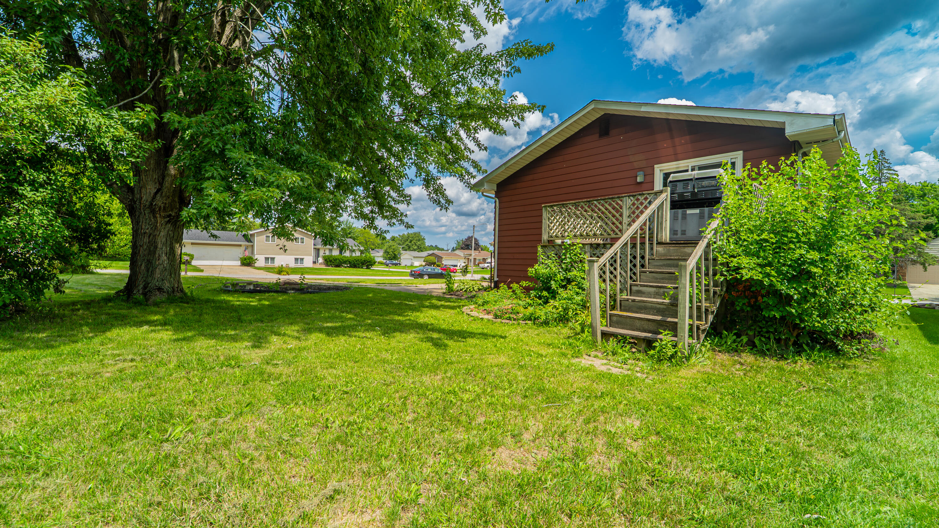 2008 Sir Richard Road Schererville, IN 46375 - Photo 18 of 24 a view of a chair in the garden in front of house