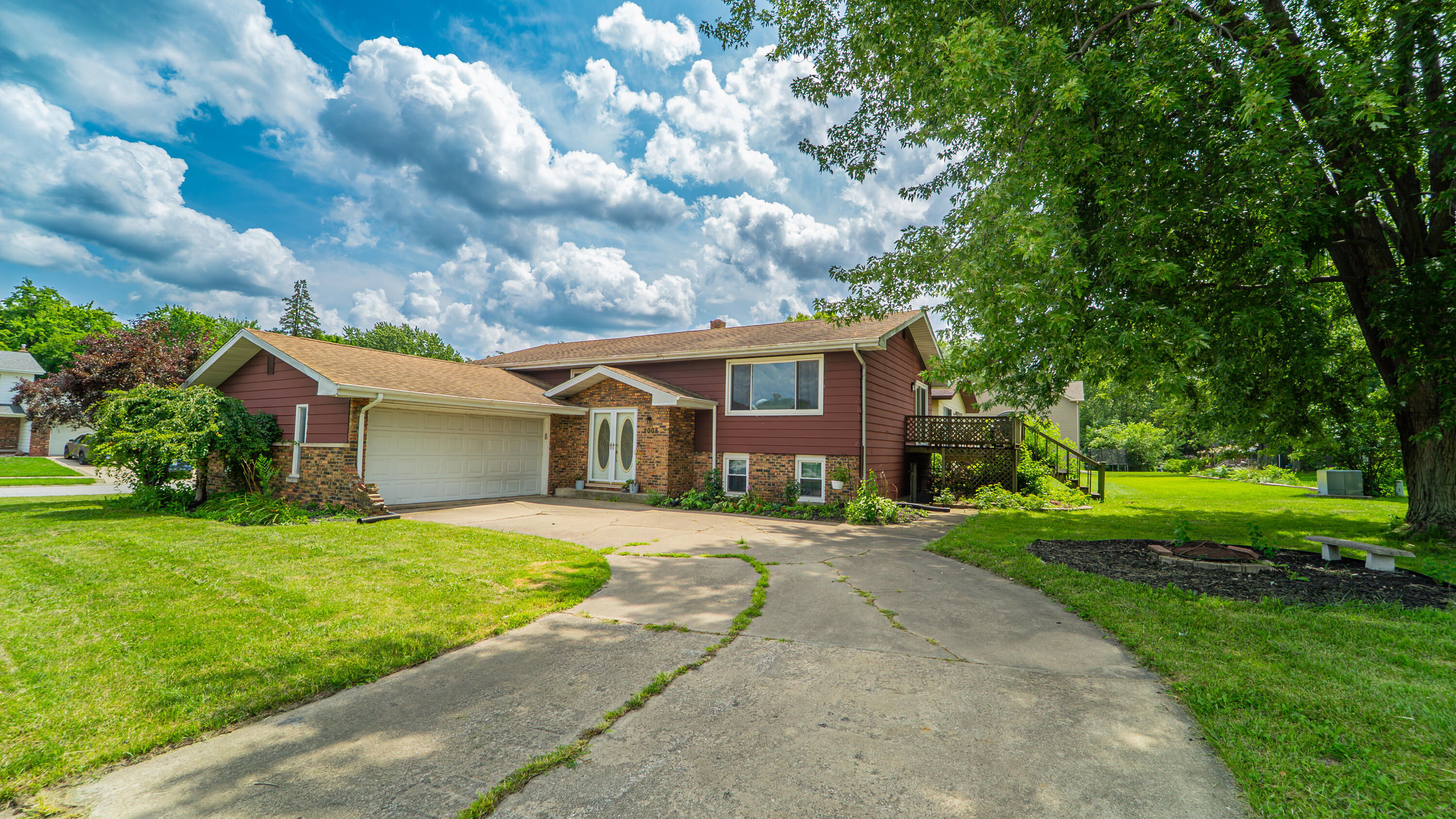2008 Sir Richard Road Schererville, IN 46375 - Photo 2 of 24 a view of a house next to a big yard and large trees