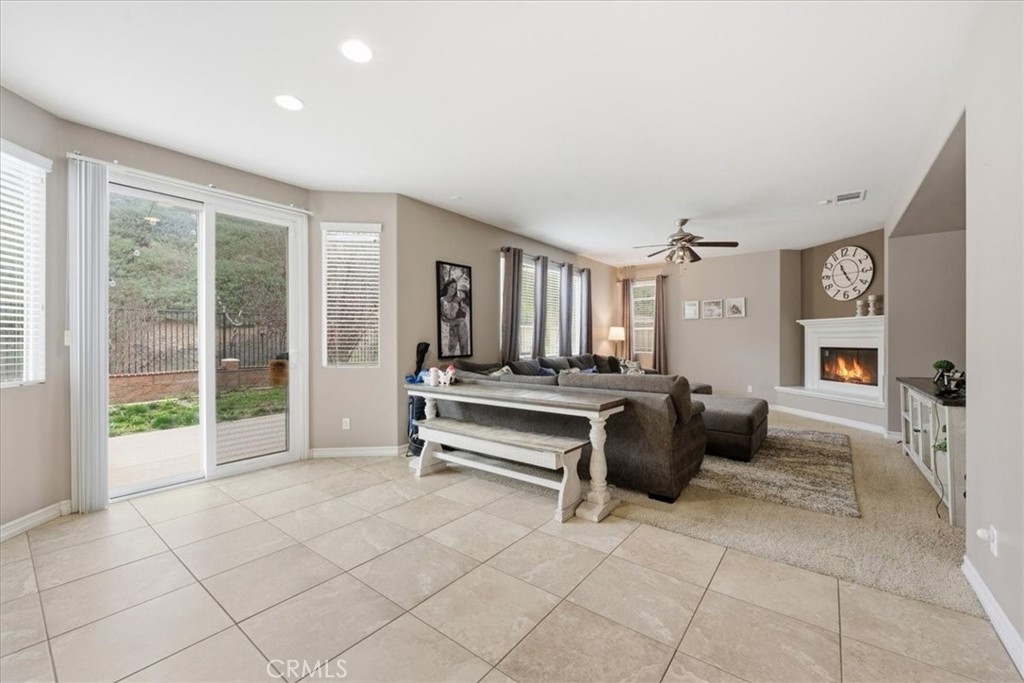 34326 Heather Ridge Road Lake Elsinore, CA 92532 - Photo 11 of 46 a living room with furniture and large windows