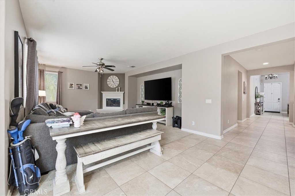 34326 Heather Ridge Road Lake Elsinore, CA 92532 - Photo 14 of 46 a living room with furniture and a flat screen tv