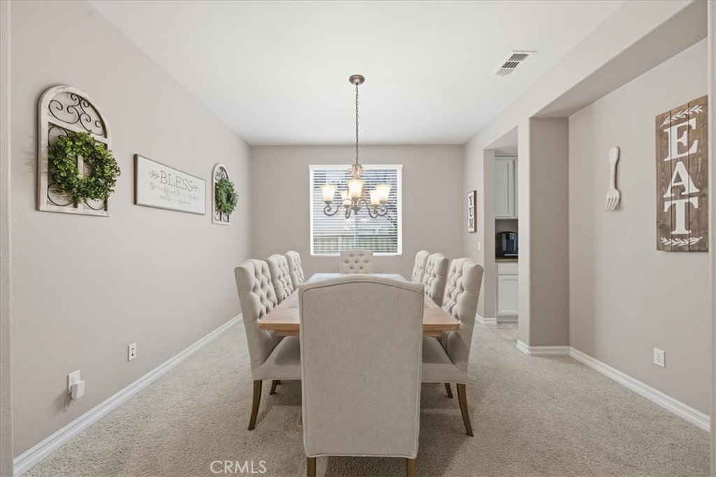 34326 Heather Ridge Road Lake Elsinore, CA 92532 - Photo 18 of 46 a dining room with furniture and window