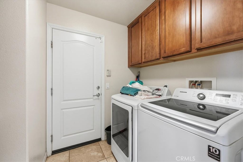 34326 Heather Ridge Road Lake Elsinore, CA 92532 - Photo 27 of 46 a utility room with dryer and washer