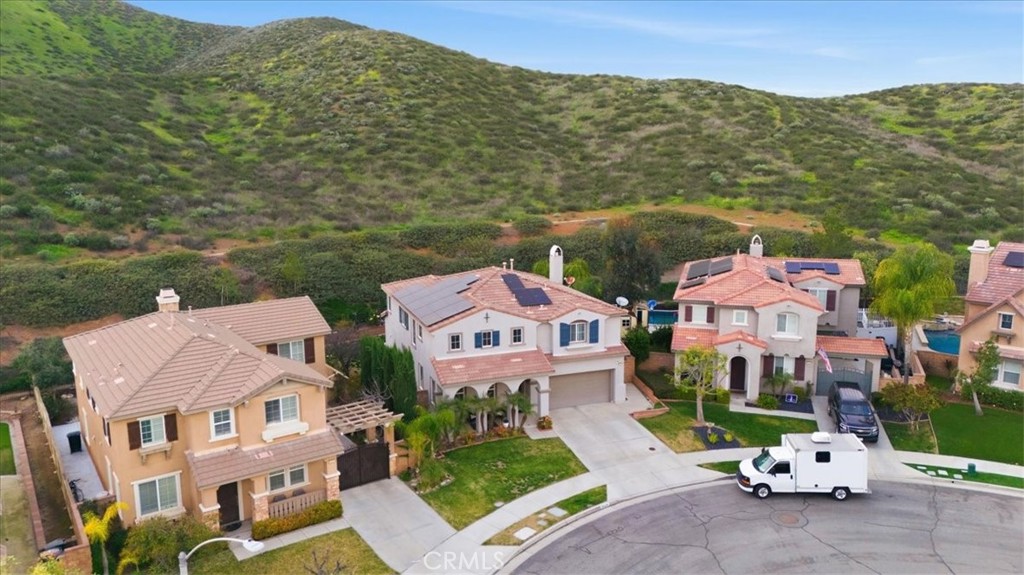 34326 Heather Ridge Road Lake Elsinore, CA 92532 - Photo 42 of 46 an aerial view of residential houses with outdoor space and trees