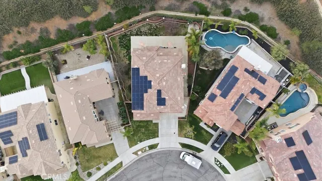 an aerial view of residential house with outdoor space and parking