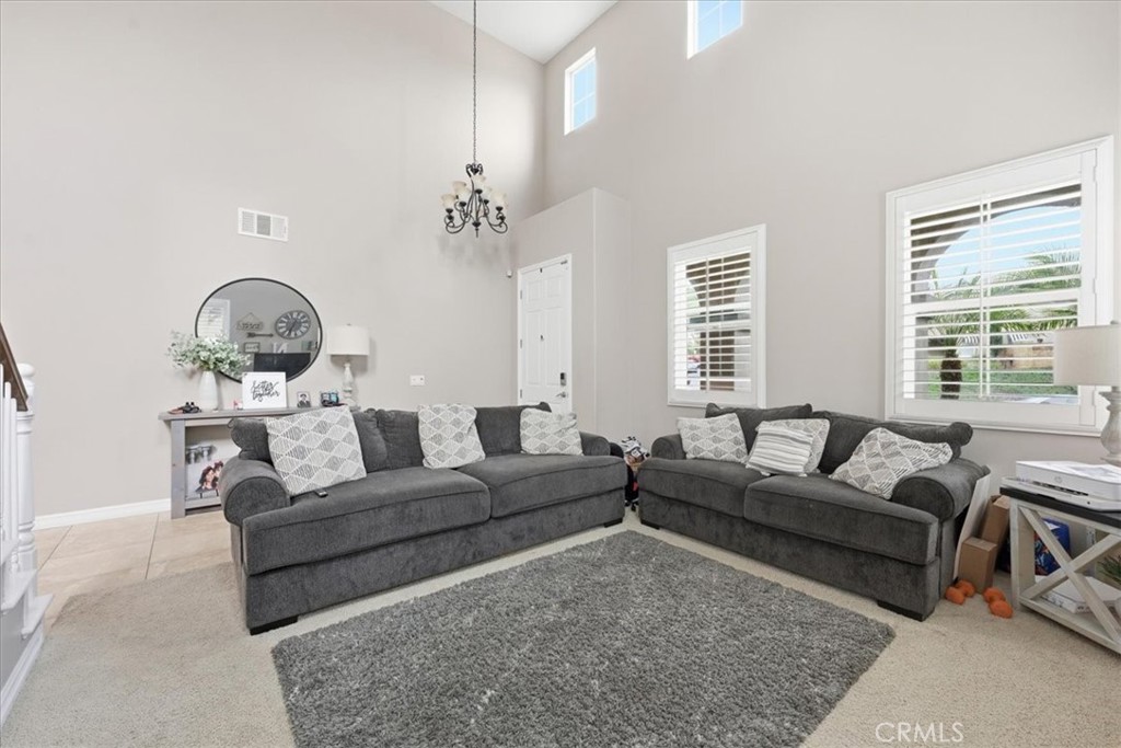 34326 Heather Ridge Road Lake Elsinore, CA 92532 - Photo 6 of 46 a living room with furniture and a large window