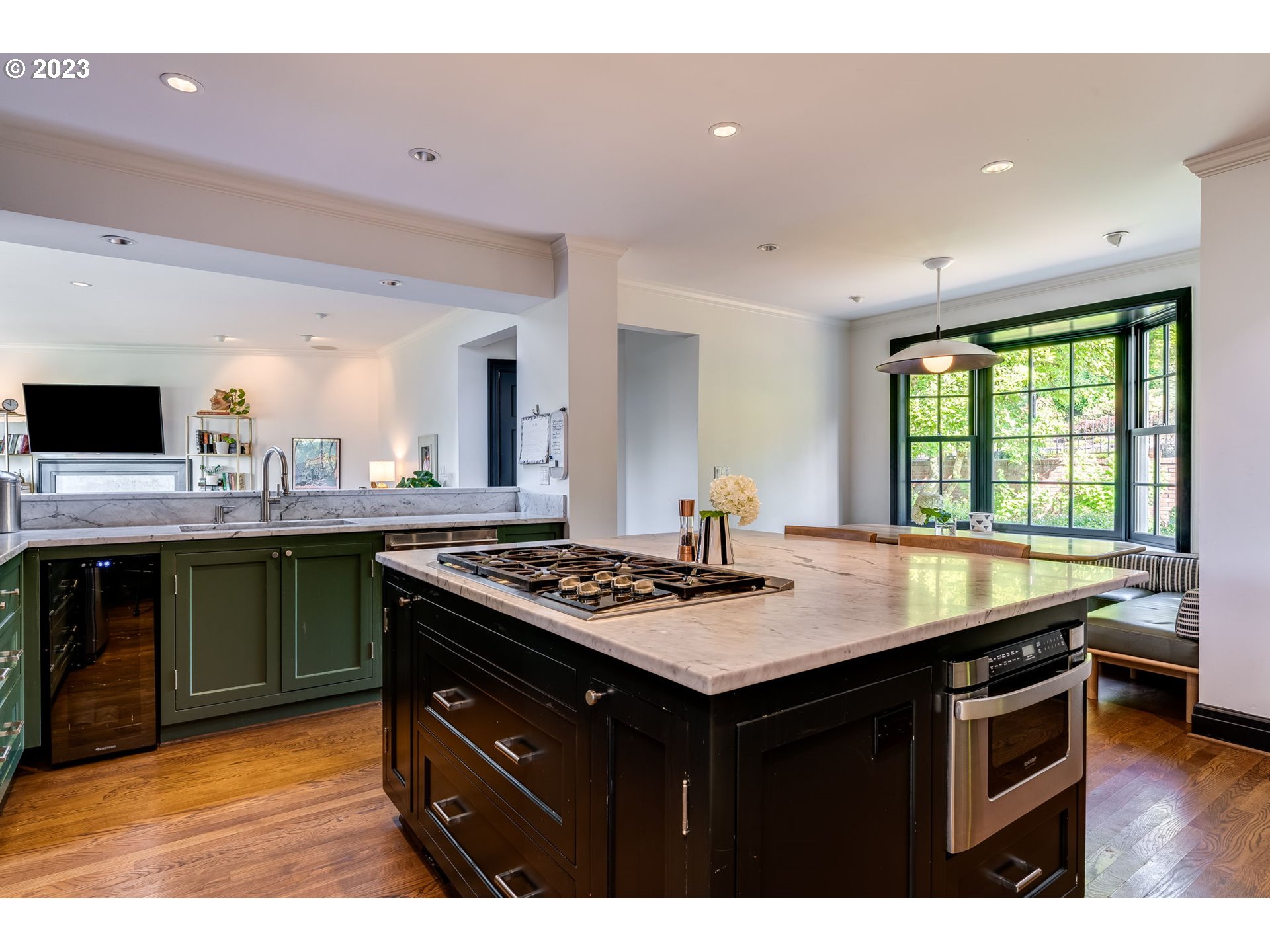 4129 Southwest Greenleaf Court Portland, OR 97221 - Photo 14 of 48 a kitchen with a stove and a sink