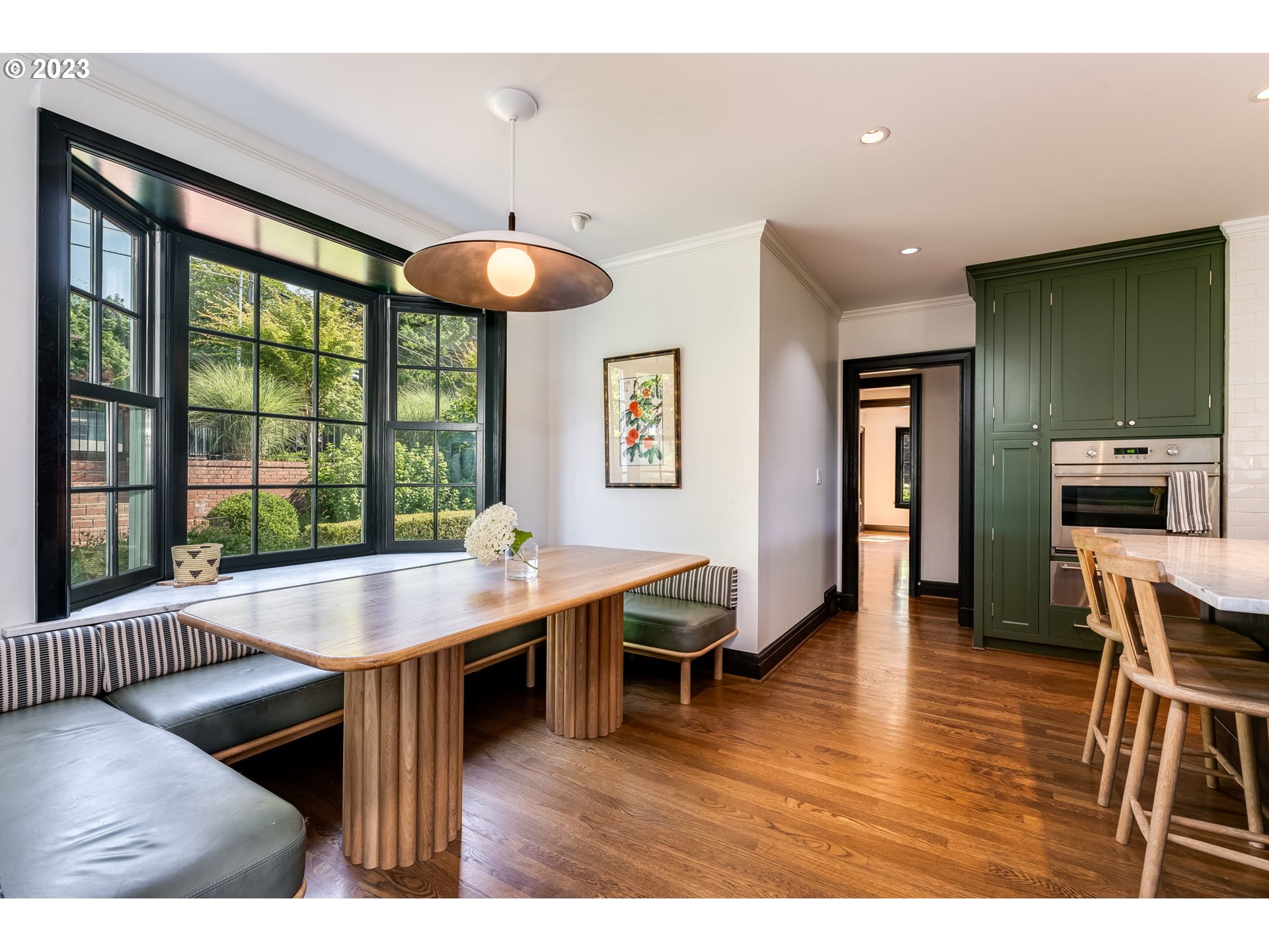 4129 Southwest Greenleaf Court Portland, OR 97221 - Photo 15 of 48 a dining room with furniture and wooden floor
