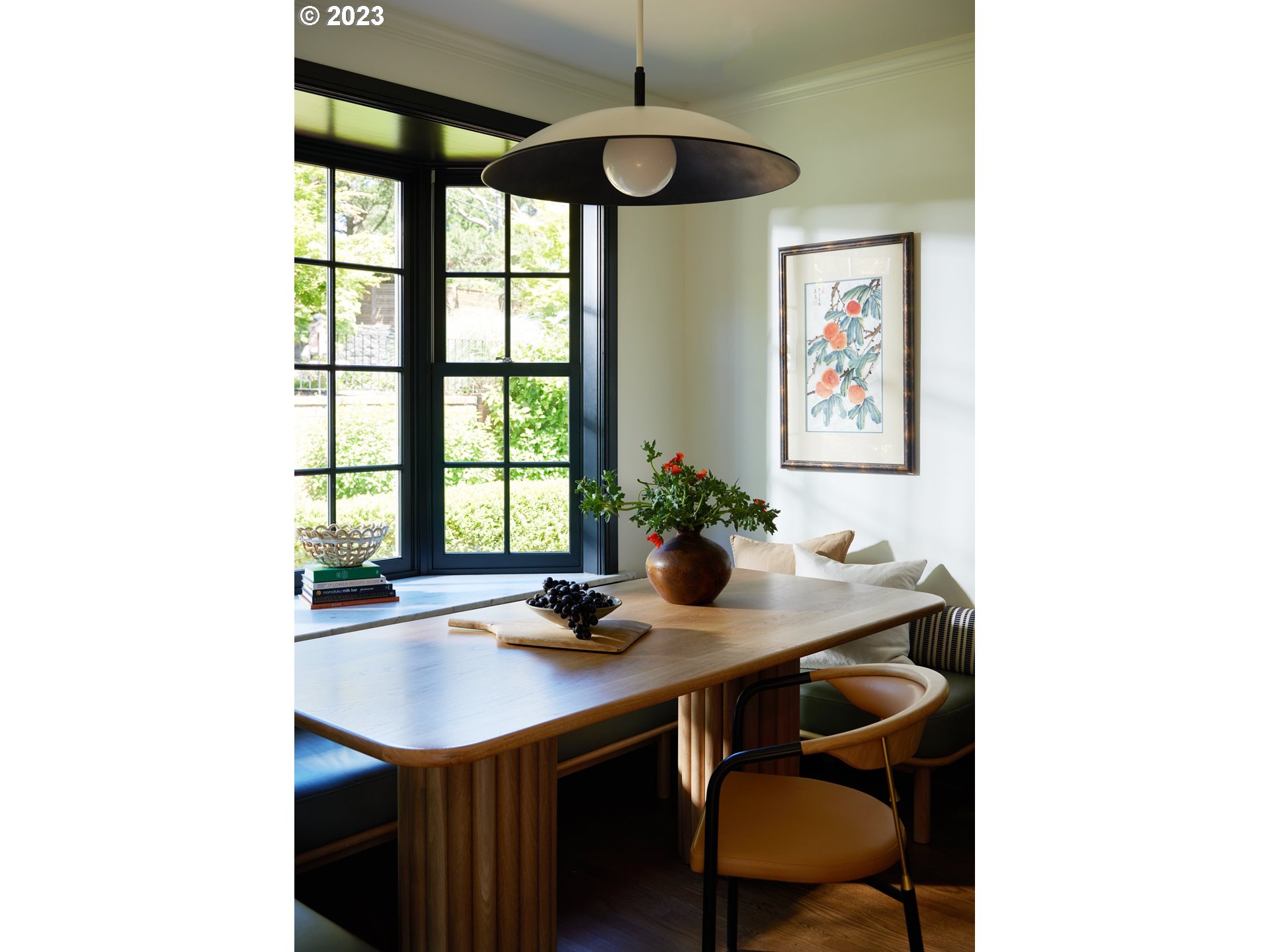 4129 Southwest Greenleaf Court Portland, OR 97221 - Photo 16 of 48 a dining room with table and chairs