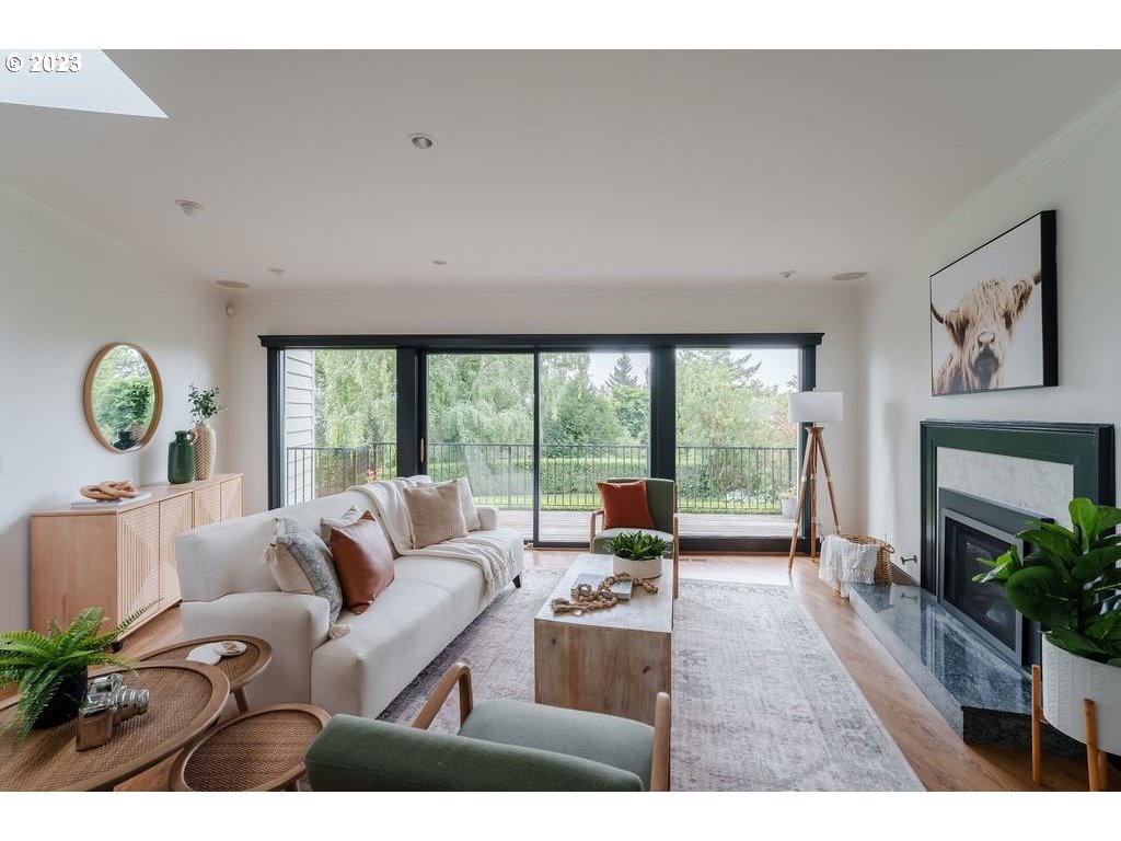 4129 Southwest Greenleaf Court Portland, OR 97221 - Photo 17 of 48 a living room with furniture and a floor to ceiling window