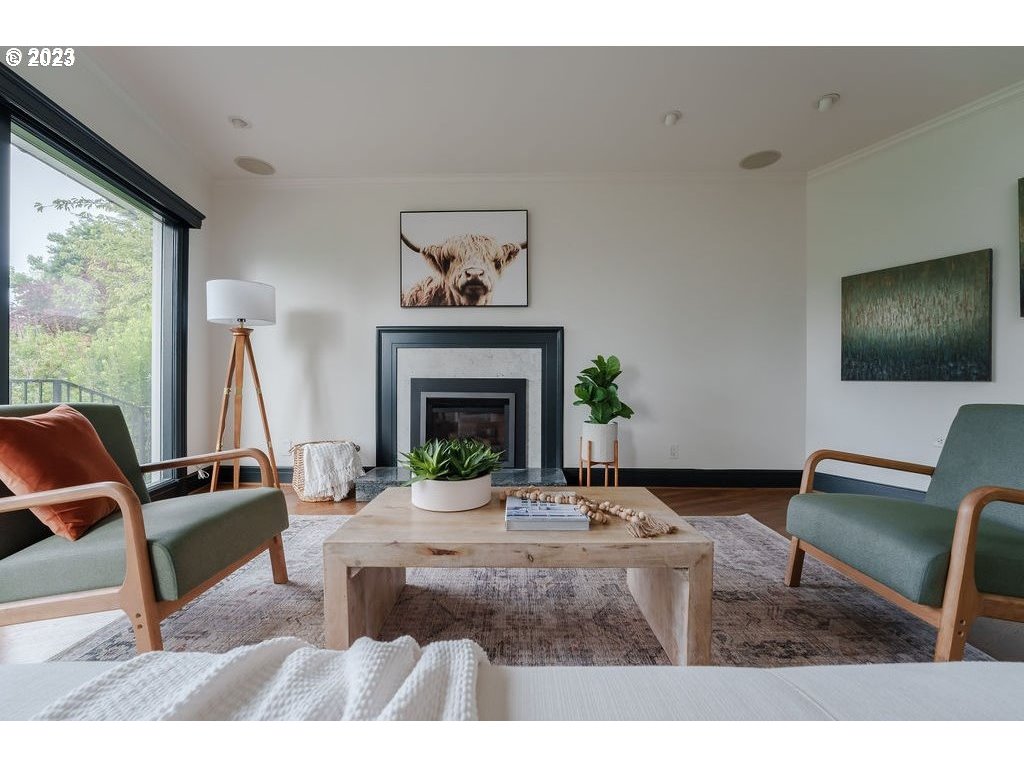 4129 Southwest Greenleaf Court Portland, OR 97221 - Photo 18 of 48 a living room with furniture a fireplace and a flat screen tv