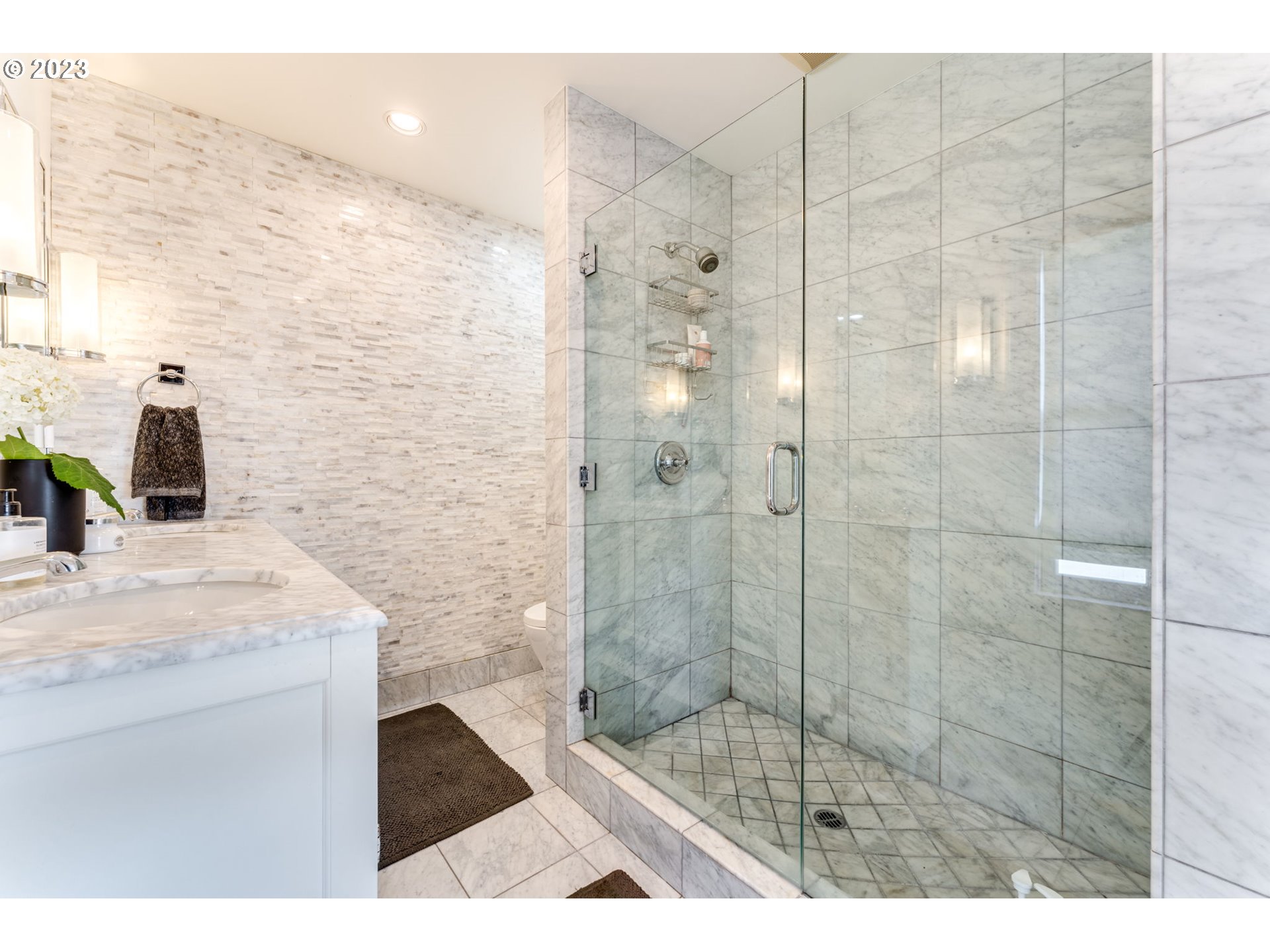 4129 Southwest Greenleaf Court Portland, OR 97221 - Photo 23 of 48 a bathroom with a shower and a sink