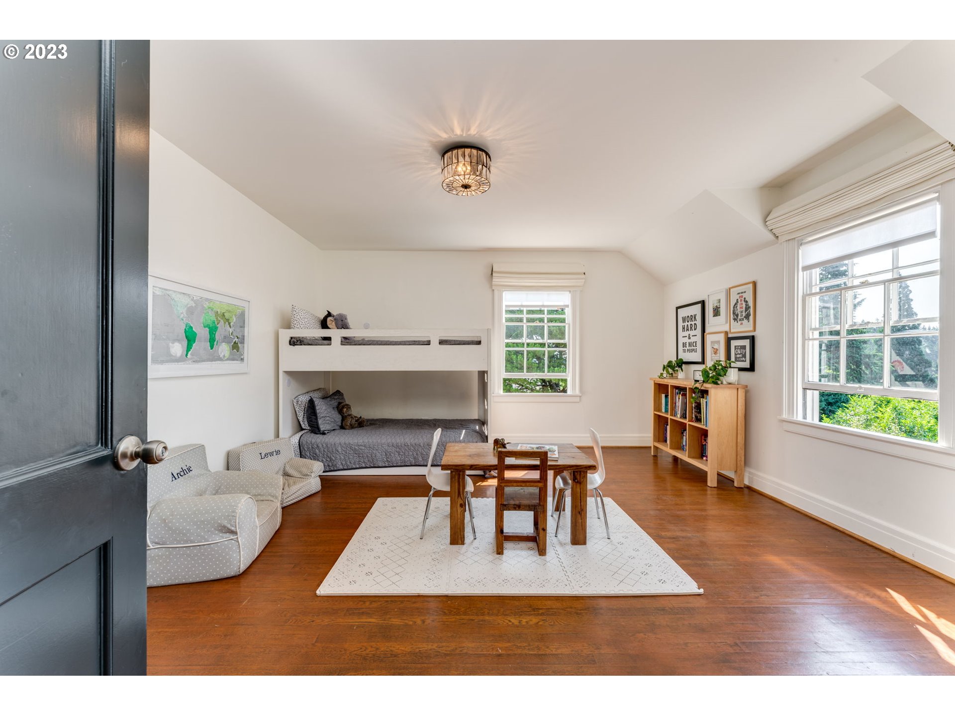 4129 Southwest Greenleaf Court Portland, OR 97221 - Photo 27 of 48 a living room with furniture and a fireplace