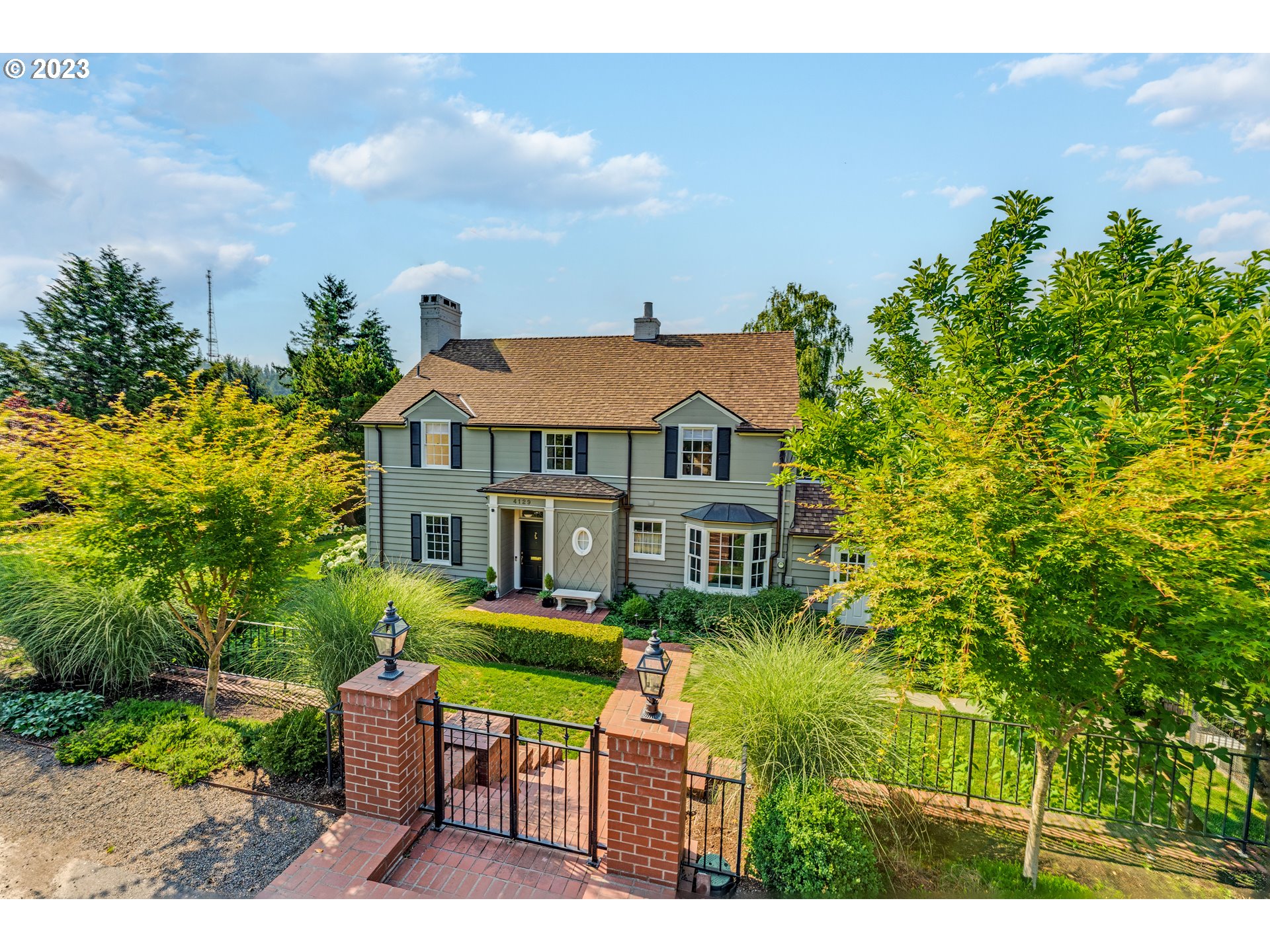 4129 Southwest Greenleaf Court Portland, OR 97221 - Photo 3 of 48 a house view with a garden space