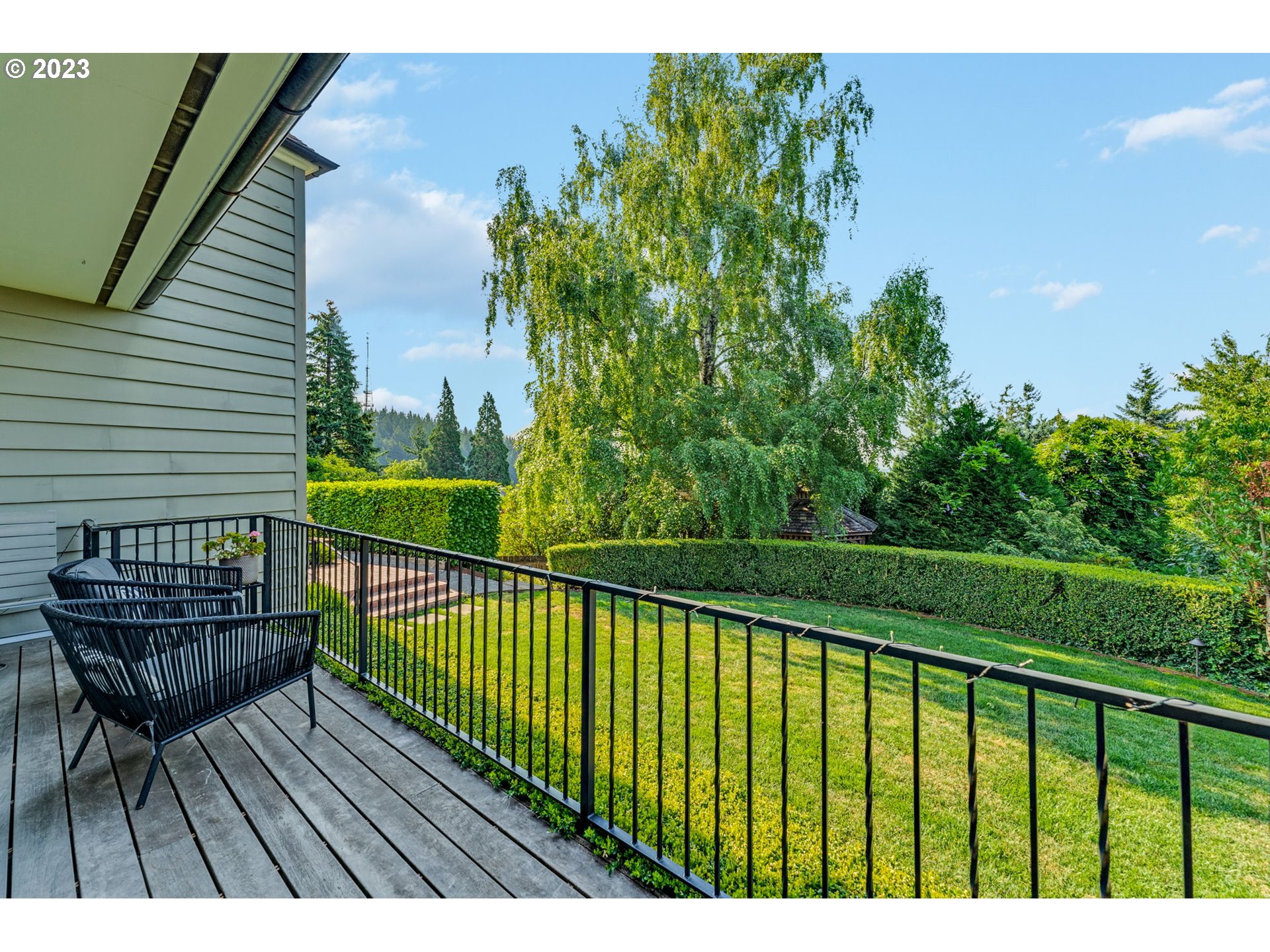 4129 Southwest Greenleaf Court Portland, OR 97221 - Photo 33 of 48 a view of balcony with wooden floor and outdoor seating