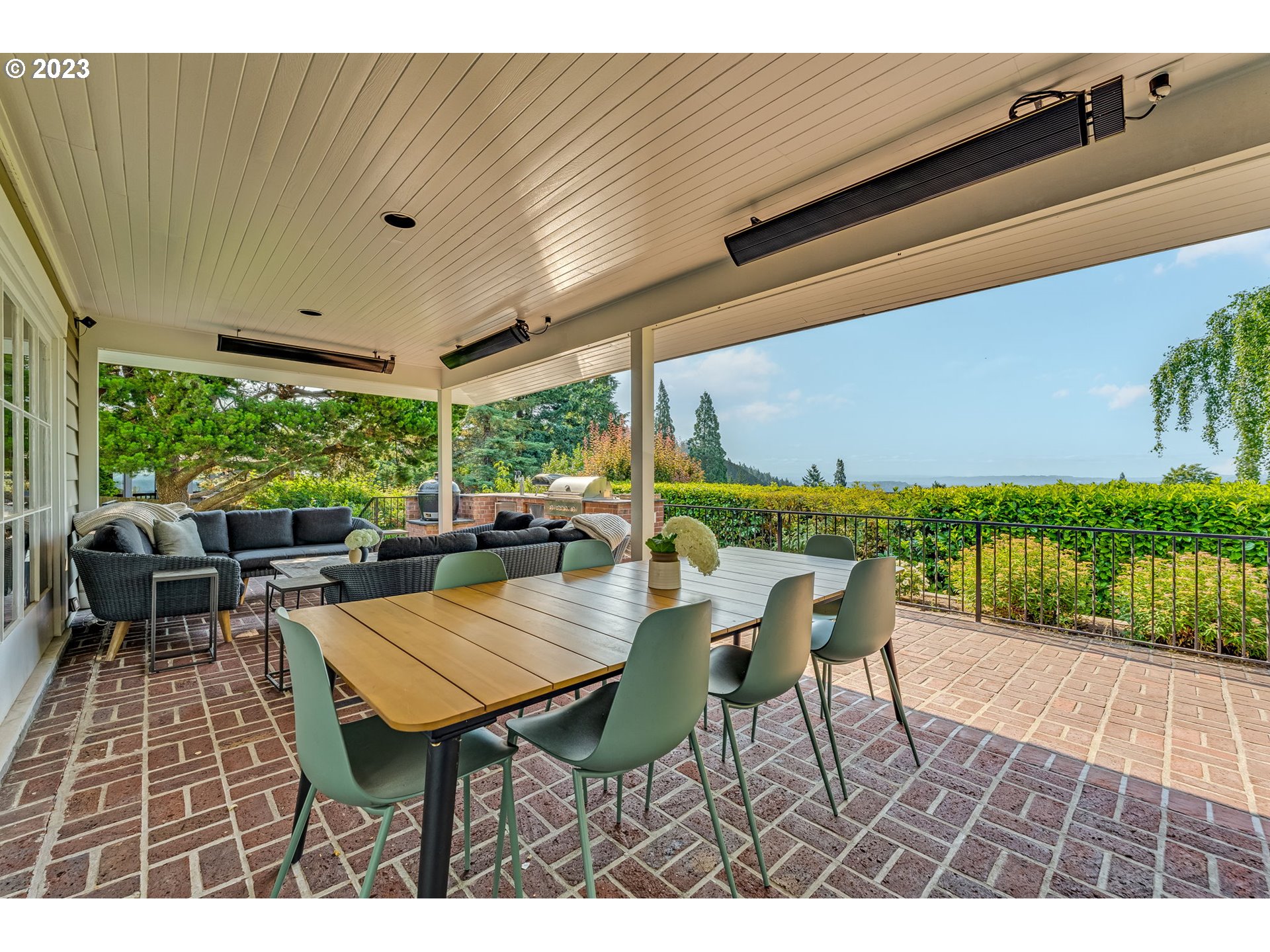 4129 Southwest Greenleaf Court Portland, OR 97221 - Photo 35 of 48 a view of a patio with a dining table and chairs
