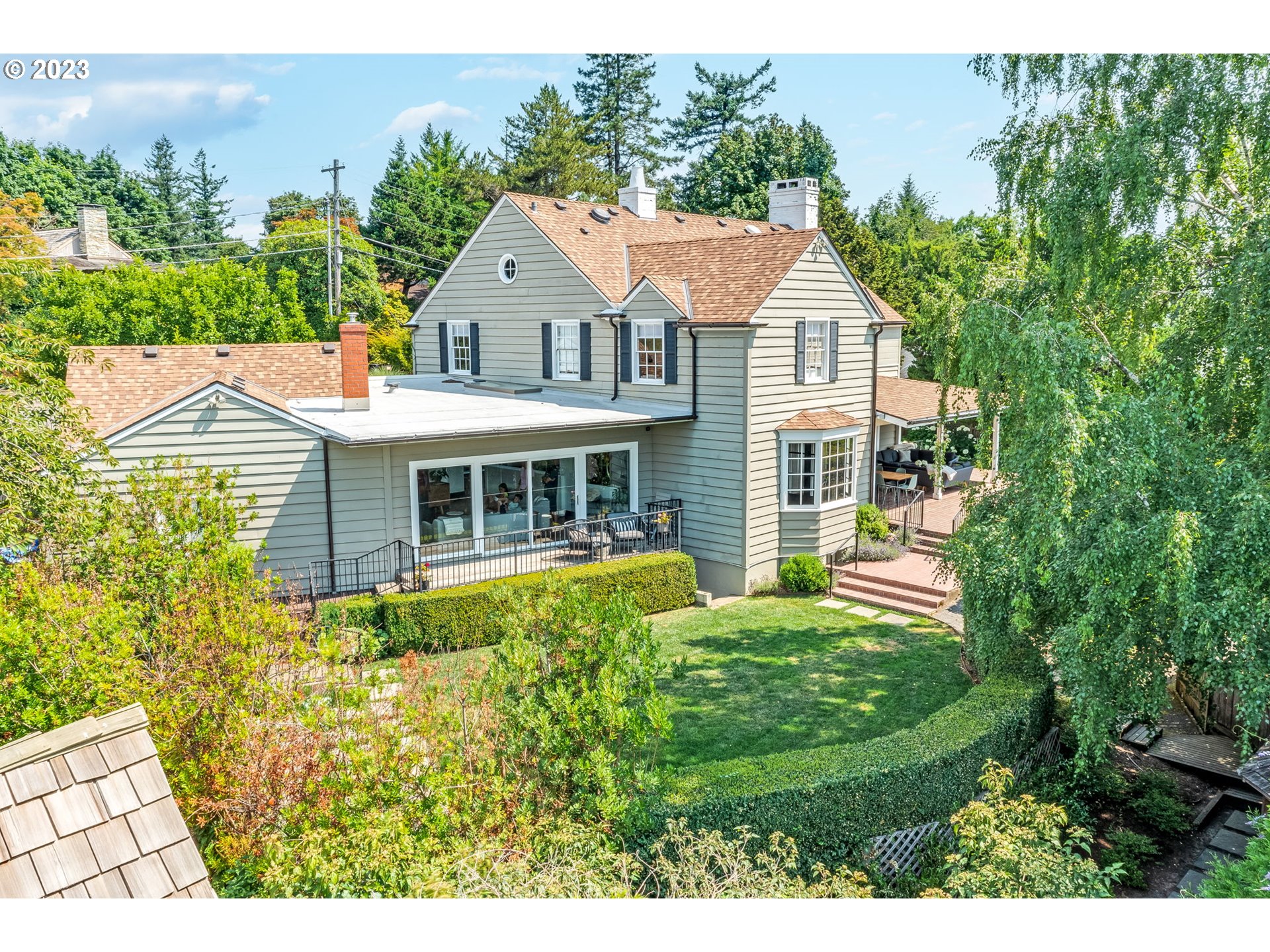 4129 Southwest Greenleaf Court Portland, OR 97221 - Photo 42 of 48 a aerial view of a house with a yard table and chairs