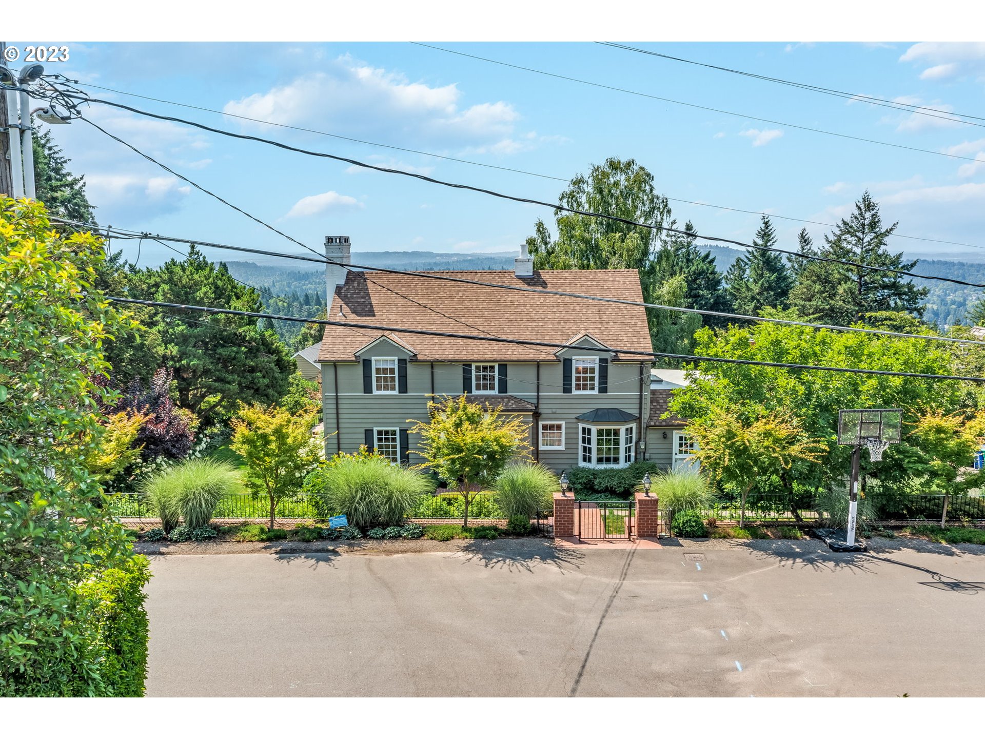 4129 Southwest Greenleaf Court Portland, OR 97221 - Photo 46 of 48 a front view of a house with a garden