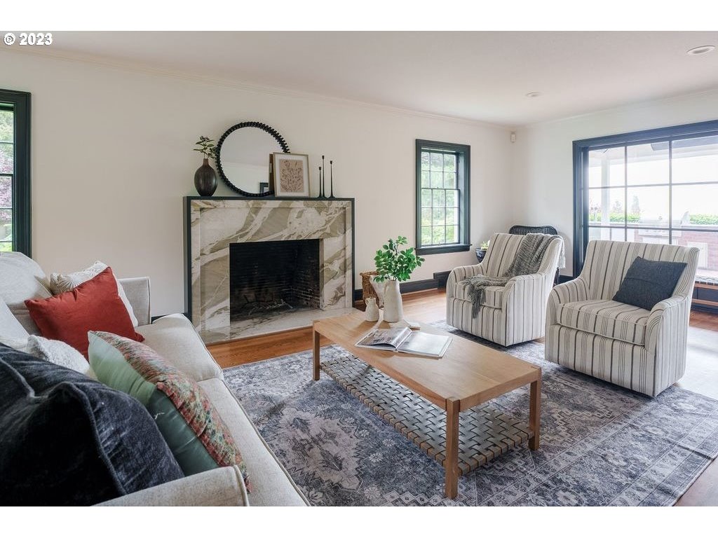 4129 Southwest Greenleaf Court Portland, OR 97221 - Photo 6 of 48 a living room with furniture and a fireplace