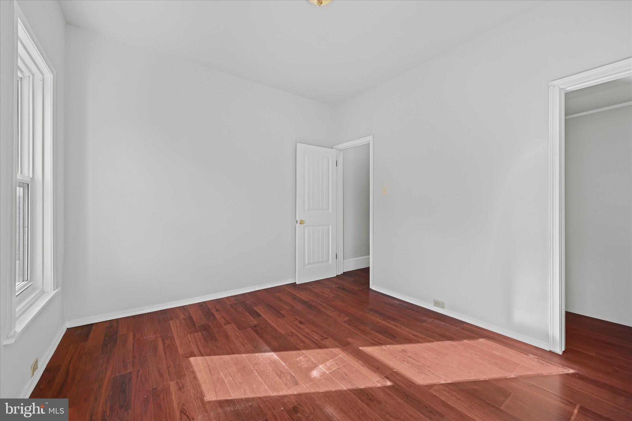 1042 Locust Street Reading, PA 19604 - Photo 16 of 28 a view of empty room with wooden floor