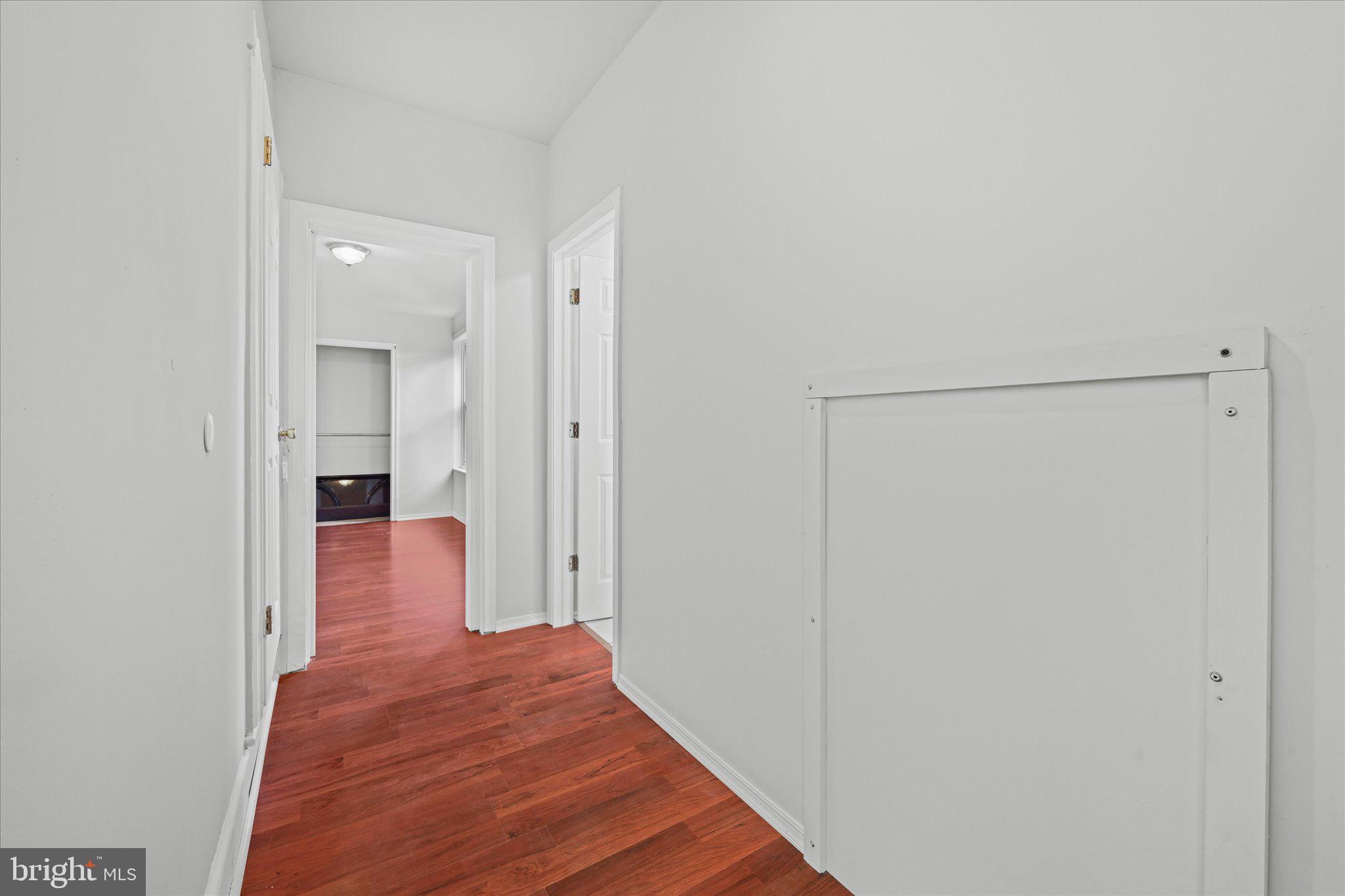 1042 Locust Street Reading, PA 19604 - Photo 17 of 28 a view of a hallway with wooden floor
