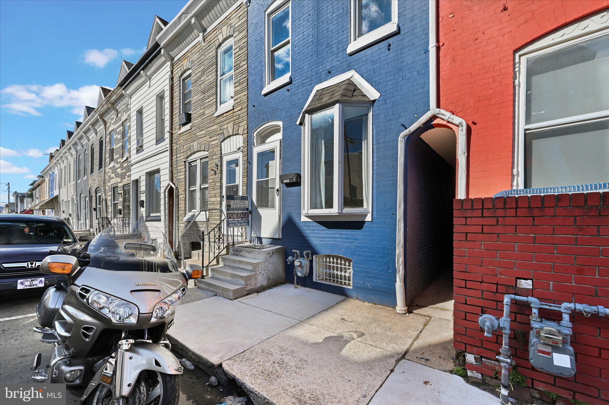 1042 Locust Street Reading, PA 19604 - Photo 2 of 28 a view of a brick building with many windows