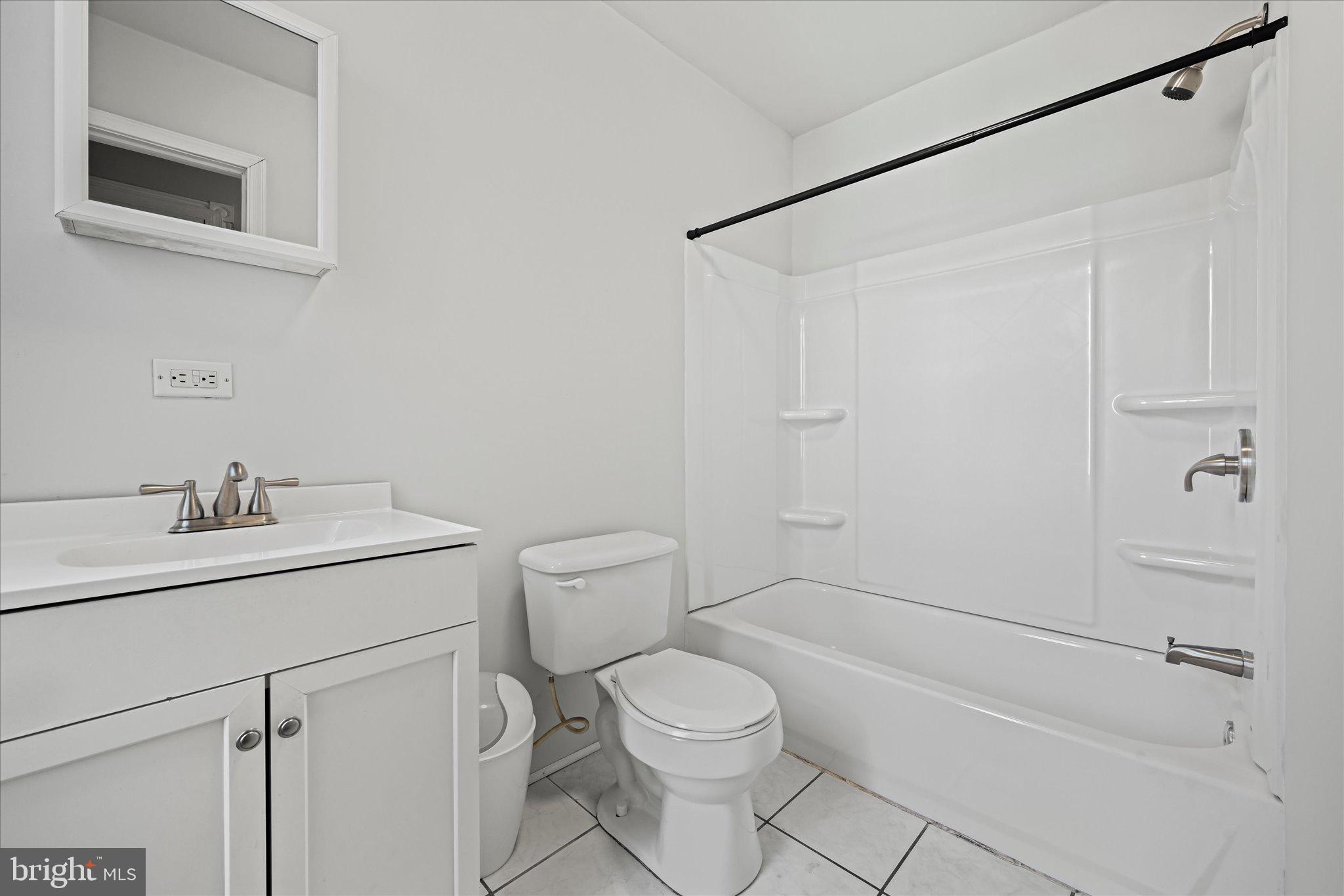 1042 Locust Street Reading, PA 19604 - Photo 21 of 28 a bathroom with a sink a toilet and shower