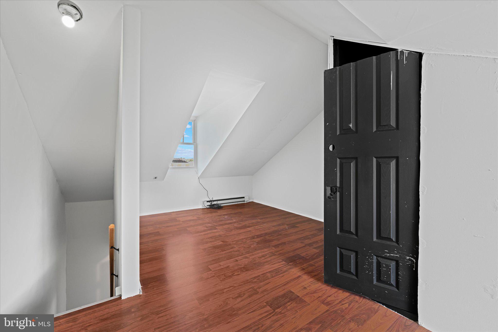 1042 Locust Street Reading, PA 19604 - Photo 23 of 28 a view of a hallway with wooden floor and entryway