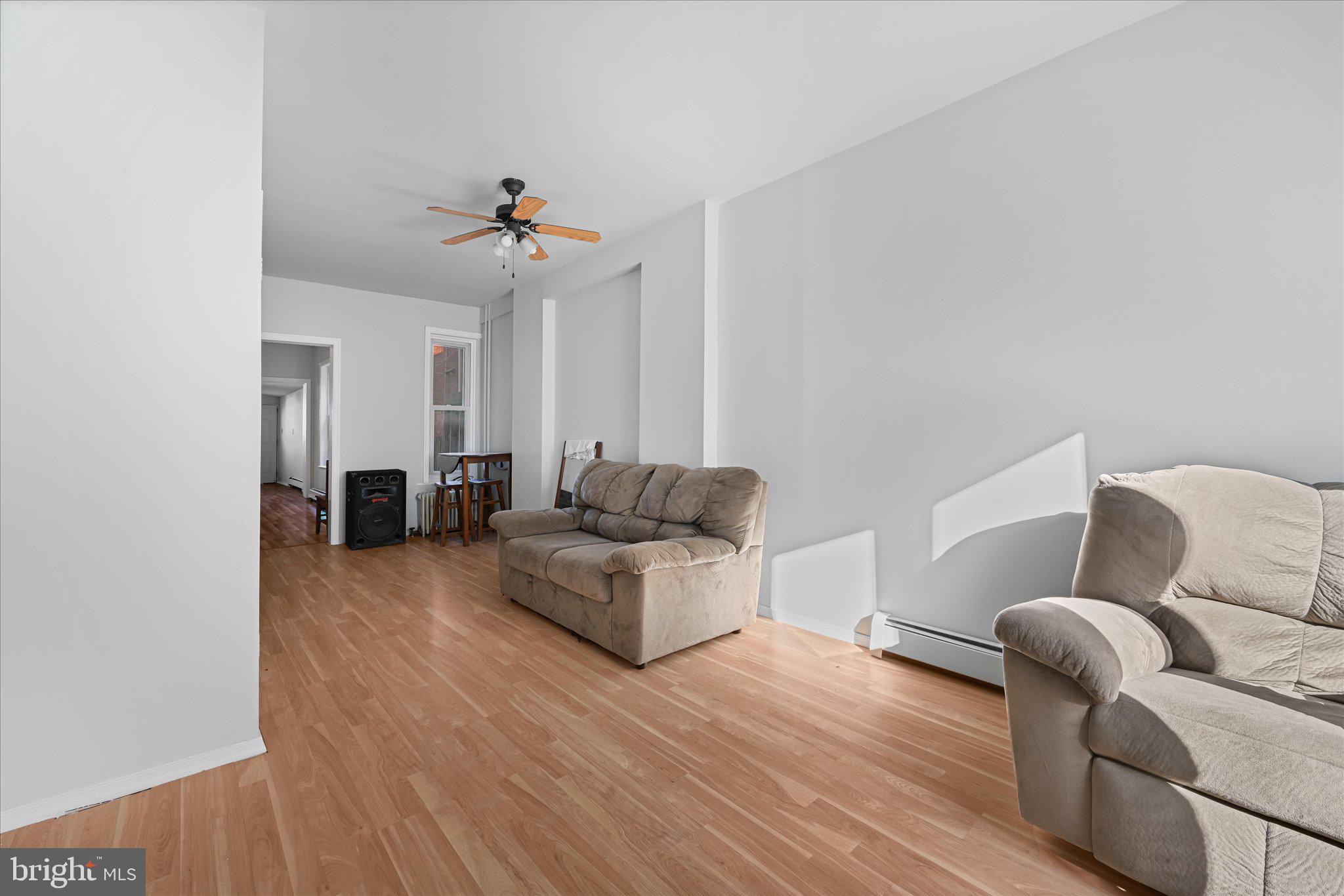 1042 Locust Street Reading, PA 19604 - Photo 4 of 28 a living room with furniture and a wooden floor