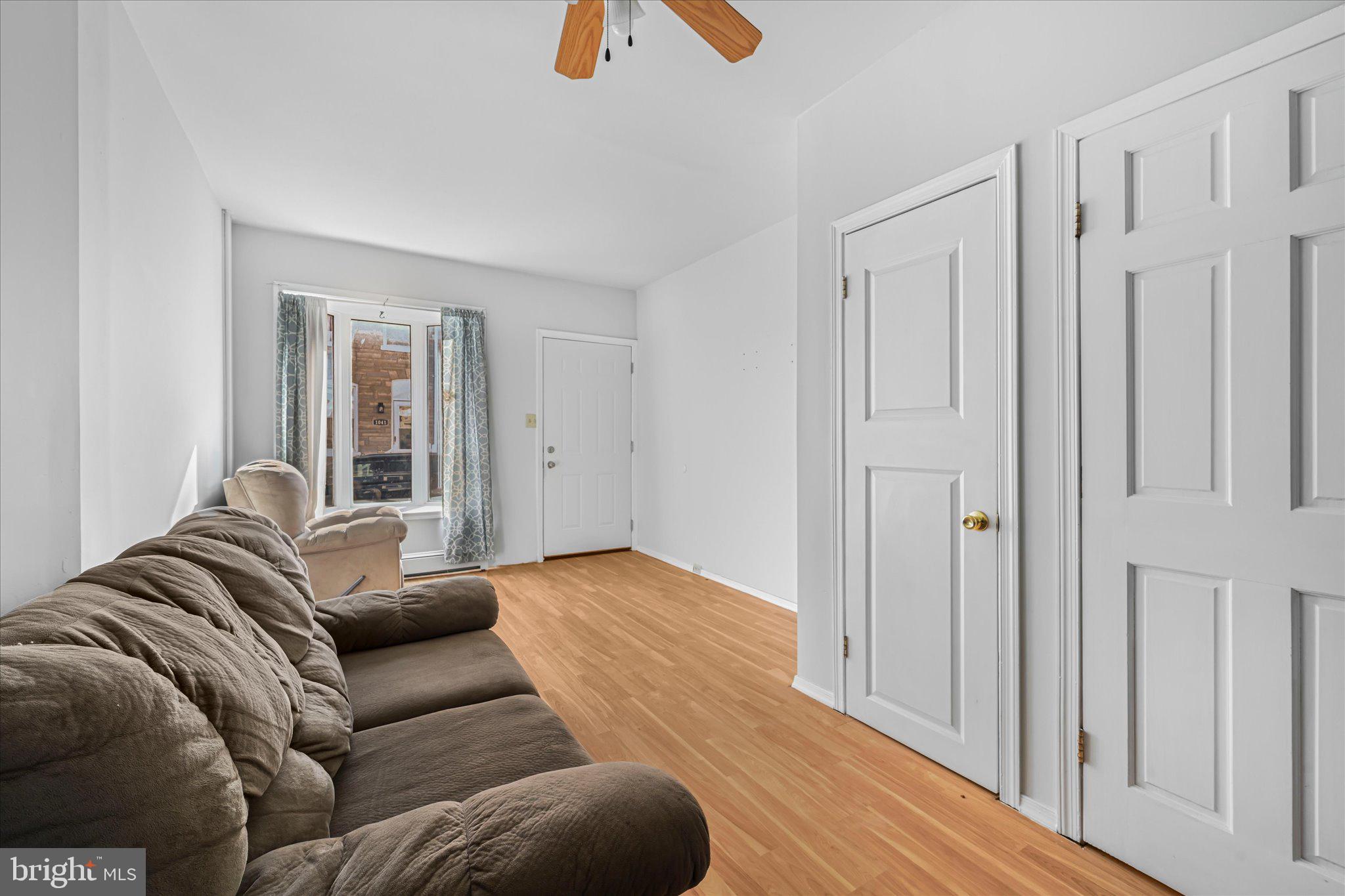 1042 Locust Street Reading, PA 19604 - Photo 5 of 28 a living room with furniture and a rug