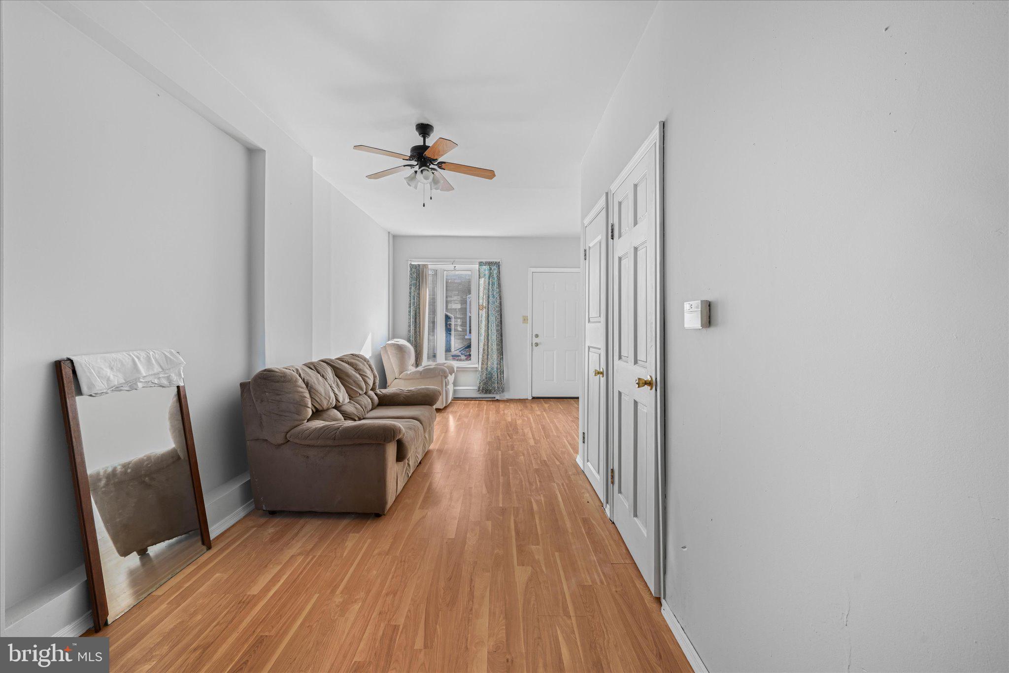 1042 Locust Street Reading, PA 19604 - Photo 6 of 28 a living room with furniture and a wooden floor