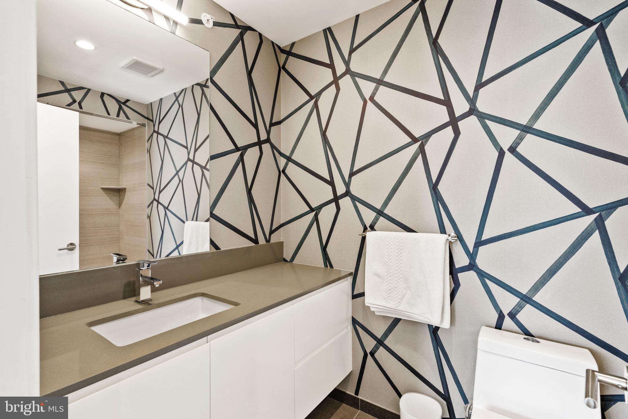 609 Queen Street Philadelphia, PA 19147 - Photo 19 of 29 a bathroom with a sink and a mirror