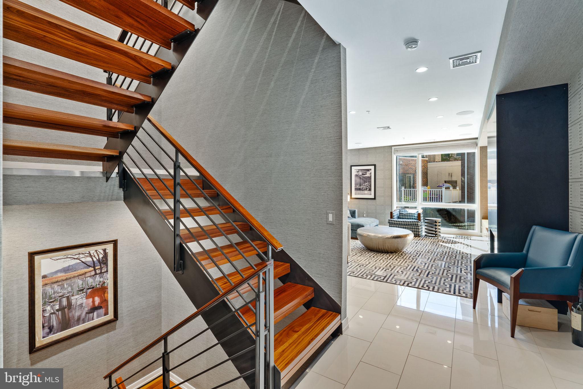 609 Queen Street Philadelphia, PA 19147 - Photo 6 of 29 a hallway with furniture and stairs