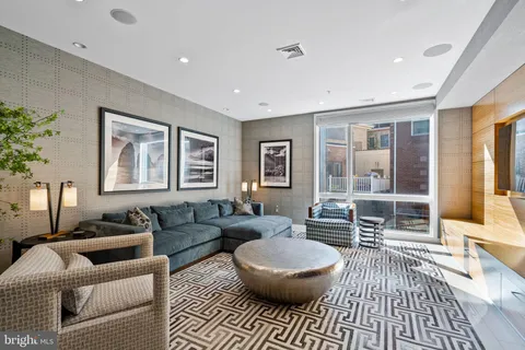 a living room with furniture and a rug