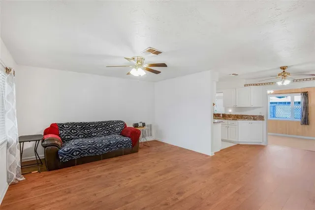 a view of room with wooden floor