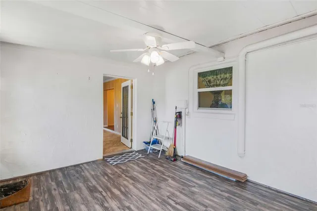 a kitchen with granite countertop a stove sink and microwave