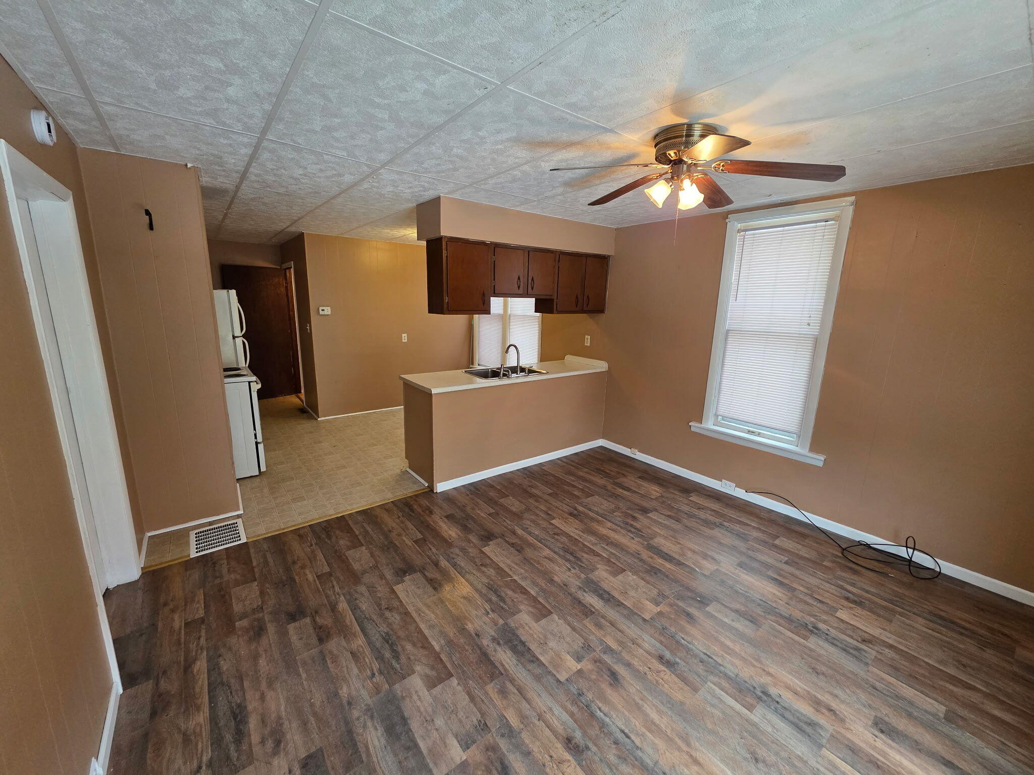 75 Filer Street, Unit 1 Manistee, MI 49660 - Photo 2 of 7 (1) IMG_20260210_103032 Living Rm