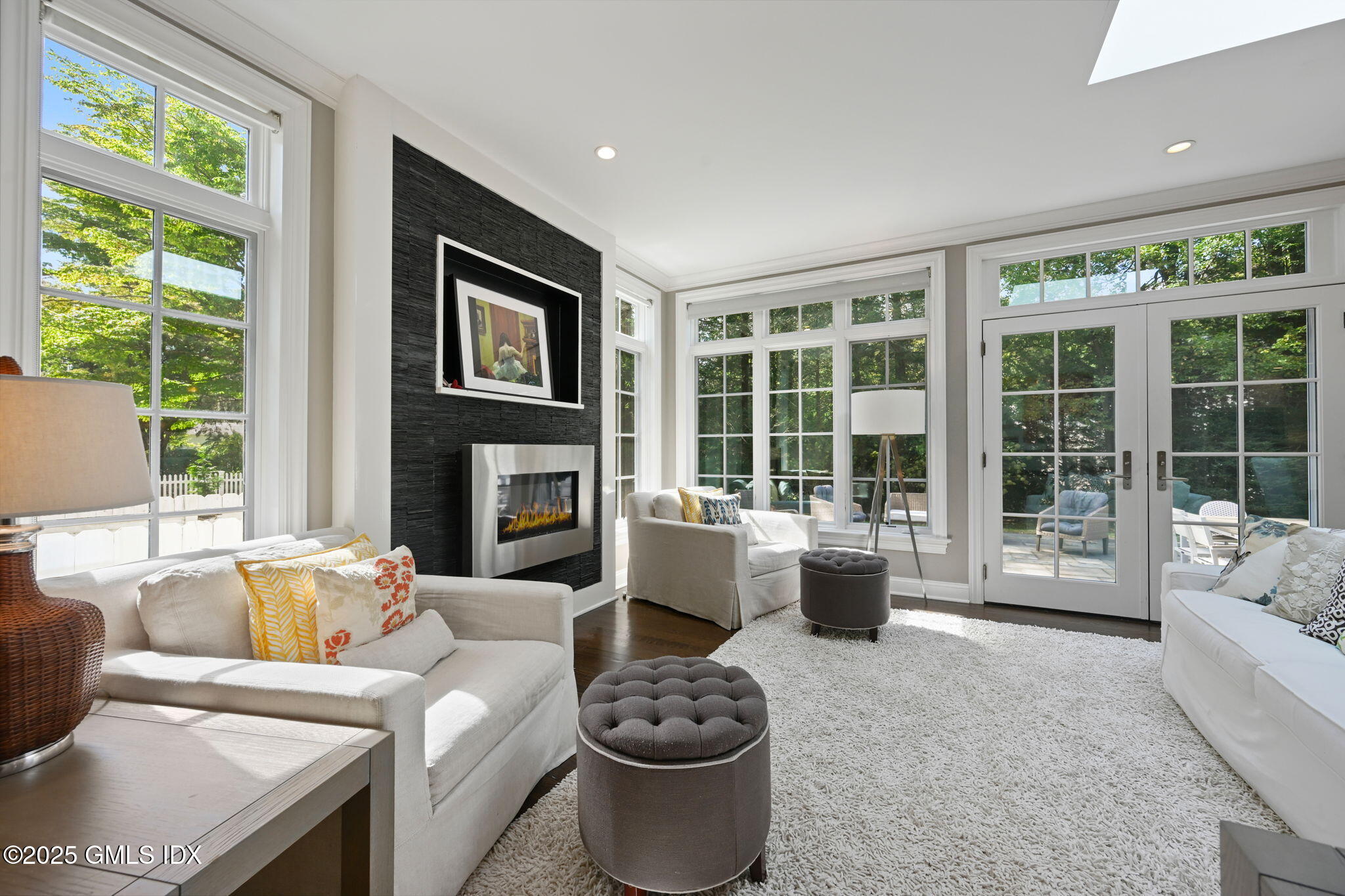 37 Ridgeview Avenue Greenwich, CT 06830 - Photo 14 of 49 a living room with furniture a large window and a fireplace