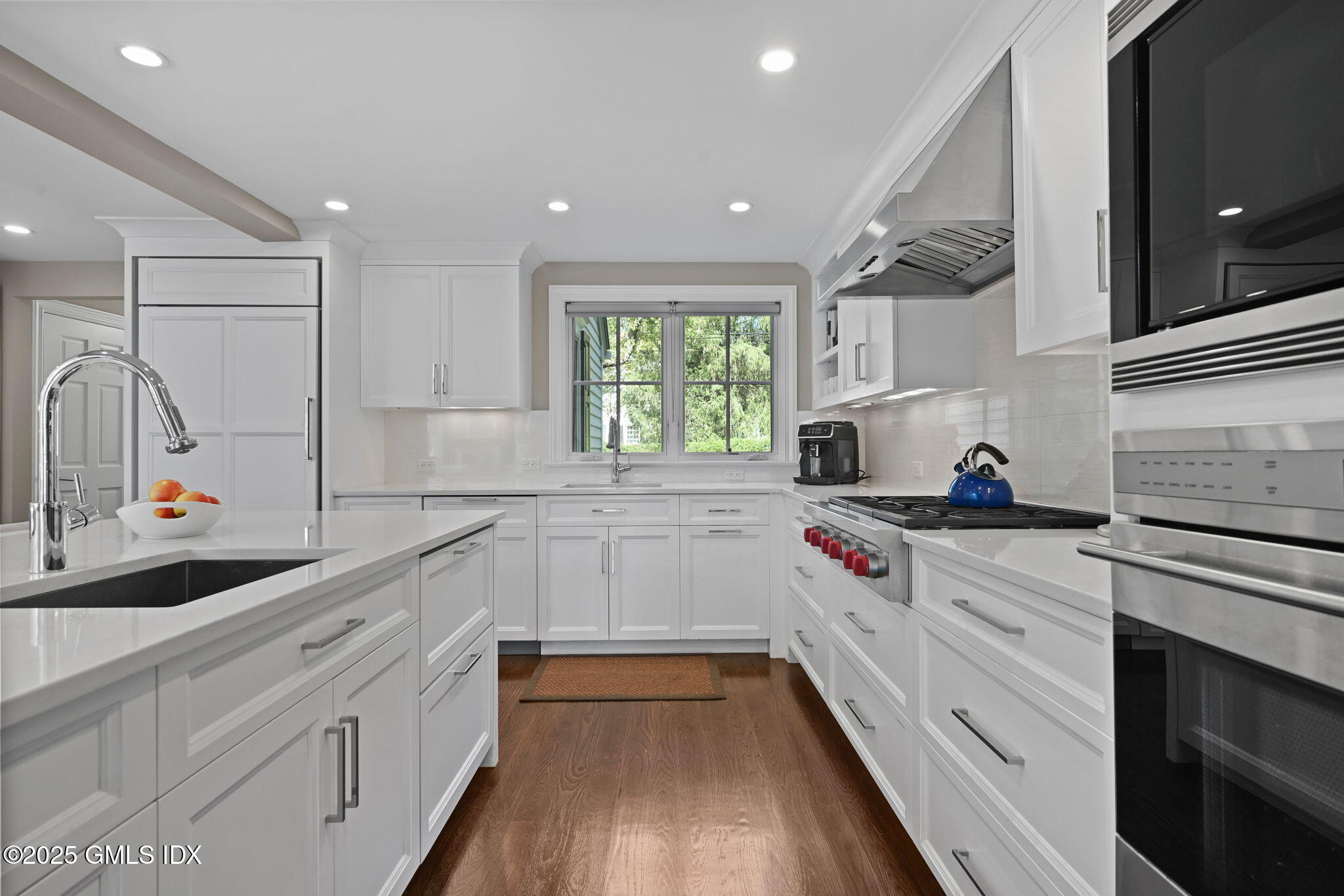 37 Ridgeview Avenue Greenwich, CT 06830 - Photo 21 of 49 a kitchen with white cabinets and white appliances
