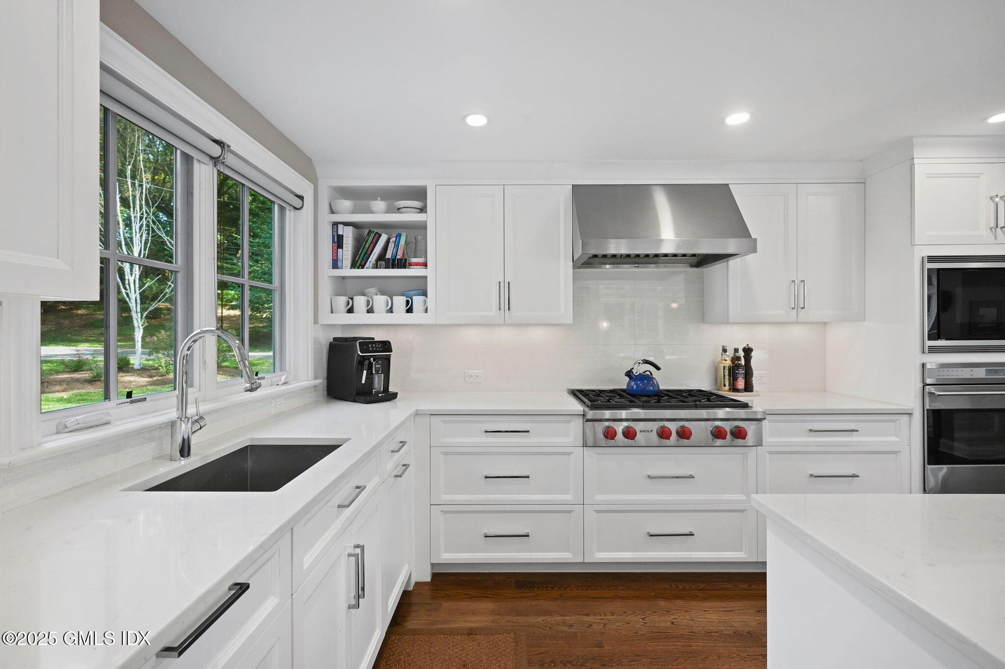 37 Ridgeview Avenue Greenwich, CT 06830 - Photo 23 of 49 a kitchen with white cabinets and appliances