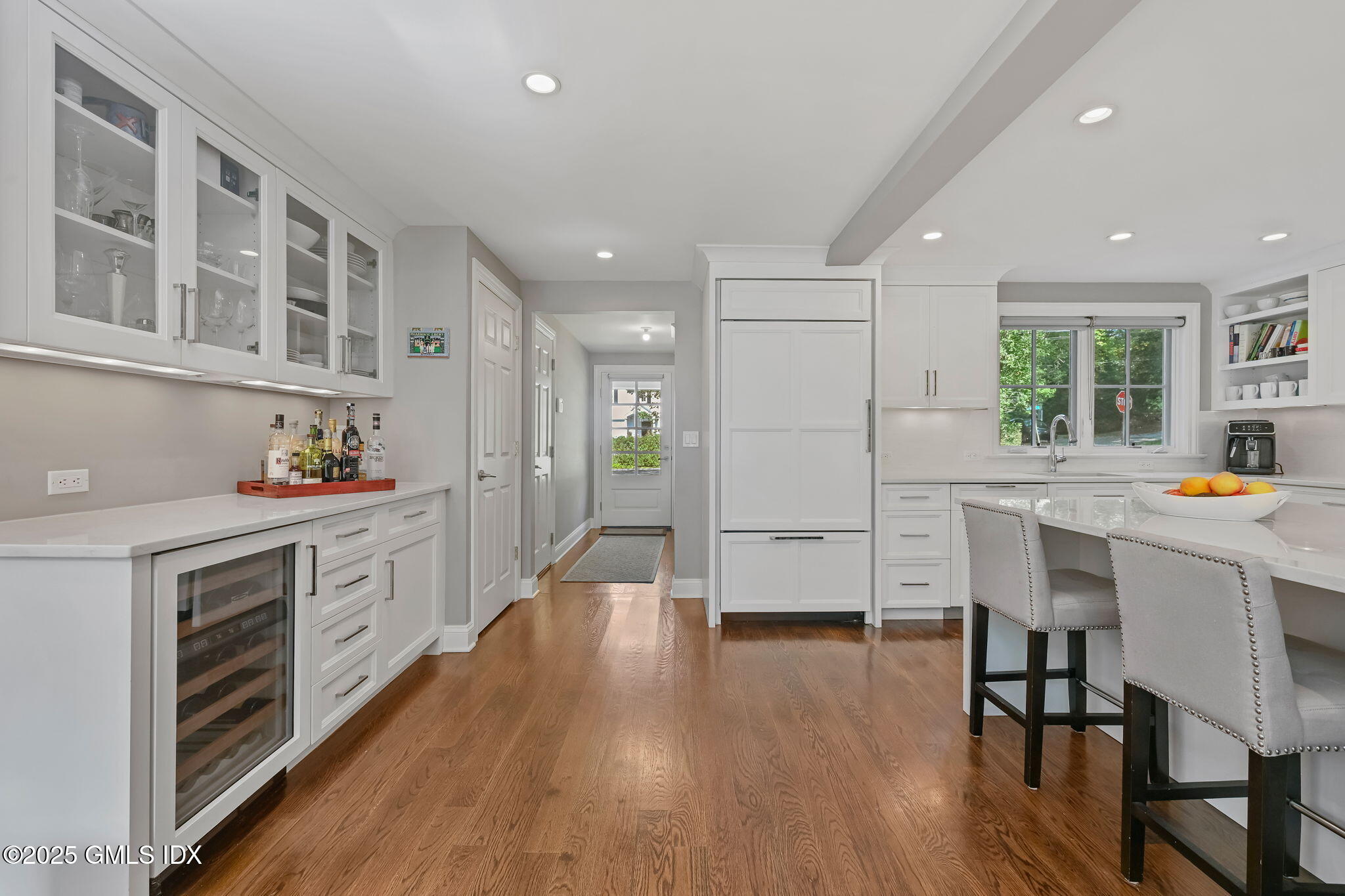 37 Ridgeview Avenue Greenwich, CT 06830 - Photo 25 of 49 a kitchen with stainless steel appliances kitchen island wooden floors and white cabinets